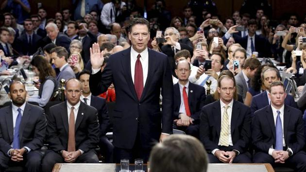 Former FBI Director James Comey is sworn in during a Senate Intelligence Committee hearing on Thursday in Washington. (AP) Former FBI Director James Comey is sworn in during a Senate Intelligence Committee hearing on Thursday in Washington. (AP)