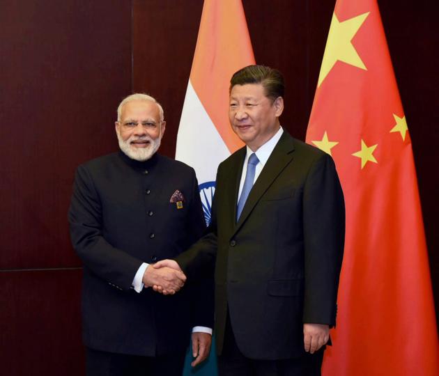 Prime Minister Narendra Modi and Chinese President Xi Jinping on the sidelines of the SCO Summit in Astana, Kazakhstan, June 9 (PTI) Prime Minister Narendra Modi and Chinese President Xi Jinping on the sidelines of the SCO Summit in Astana, Kazakhstan, June 9 (PTI)