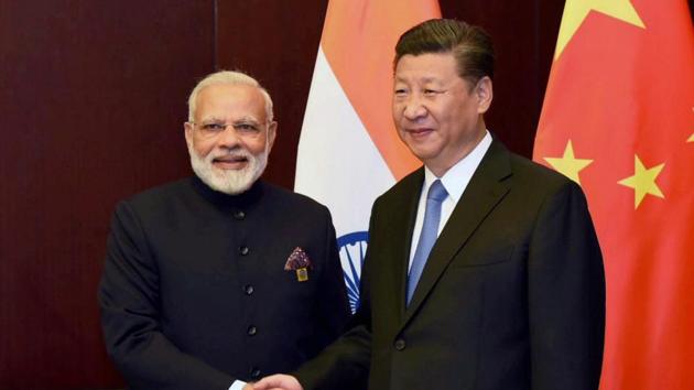 Prime Minister Narendra Modi and Chinese President Xi Jinping on the sidelines of the SCO Summit in Astana, Kazakhstan on Friday. (PTI Photo) Prime Minister Narendra Modi and Chinese President Xi Jinping on the sidelines of the SCO Summit in Astana, Kazakhstan on Friday. (PTI Photo)