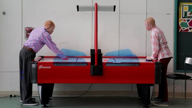 Children play air hockey as they wait to have lunch after a prosthetic fitting at a hospital in Philadelphia. (Carlo Allegri/REUTERS) Children play air hockey as they wait to have lunch after a prosthetic fitting at a hospital in Philadelphia. (Carlo Allegri/REUTERS)