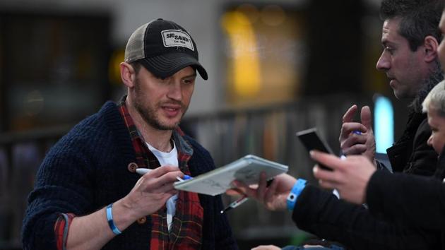 British actor Tom Hardy signs autographs for fans upon arrival at the world premiere of Alien: Covenant in London on May 4. (AFP) British actor Tom Hardy signs autographs for fans upon arrival at the world premiere of Alien: Covenant in London on May 4. (AFP)