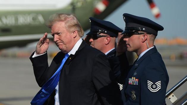 US President Donald Trump salutes a military aide upon arrival at Newark Liberty Airport in Newark, New Jersey on June 9, 2017. (AFP Photo) US President Donald Trump salutes a military aide upon arrival at Newark Liberty Airport in Newark, New Jersey on June 9, 2017. (AFP Photo)