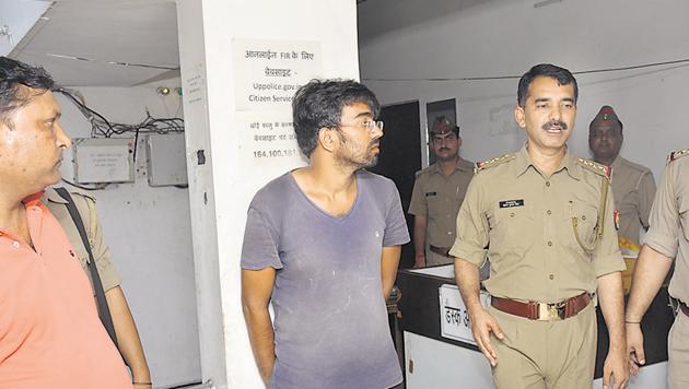 Anuj Tyagi alias Dabbu (in grey shirt) is said to suffer from schizophrenia. He had been absconding for almost a month before he was arrested from Ghaziabad on Saturday. (Sakib Ali/HT Photo) Anuj Tyagi alias Dabbu (in grey shirt) is said to suffer from schizophrenia. He had been absconding for almost a month before he was arrested from Ghaziabad on Saturday. (Sakib Ali/HT Photo)