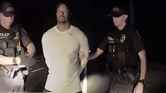 This still image from a dashcam video released by the Jupiter, Florida, Police Department on May 31 shows police offices arresting golfer Tiger Woods on May 29.(AFP)
