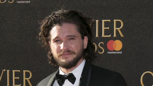 Kit Harington poses for photographers upon arrival at the Olivier Awards at the Royal Albert Hall in London.(Joel Ryan/Invision/AP)