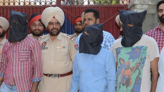 Murder suspects under police custody in Ludhiana on Saturday. (Jagtinder Singh Grewal/HT Photo) Murder suspects under police custody in Ludhiana on Saturday. (Jagtinder Singh Grewal/HT Photo)