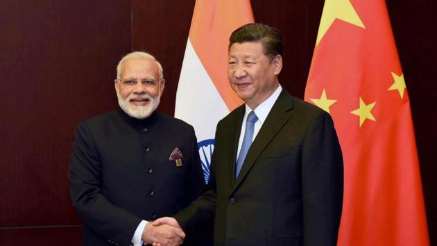 Prime Minister Narendra Modi and Chinese President Xi Jinping on the sidelines of the SCO Summit in Astana, Kazakhstan on Friday.(PTI Photo)