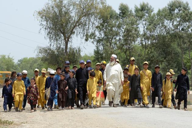 Gulzar Khan (centre) has 36 children from his three wives. (AFP) Gulzar Khan (centre) has 36 children from his three wives. (AFP)