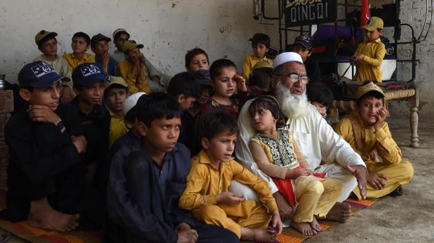 Pakistani father Gulzar Khan with his 36 children from his three wives, in the northwestern town of Bannu. Pakistan has the highest birth rate in South Asia at around three children per woman, according to the World Bank and government figures. (AFP) Pakistani father Gulzar Khan with his 36 children from his three wives, in the northwestern town of Bannu. Pakistan has the highest birth rate in South Asia at around three children per woman, according to the World Bank and government figures. (AFP)