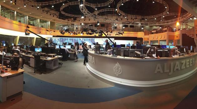In this Thursday, June 8, 2017 photo, Al Jazeera staff work at their TV station in Doha, Qatar. The Arab news network Al-Jazeera has been thrust into the center of the story this week as Qatar came under virtual siege by its Gulf neighbours, pressuring it to shut down the TV channel that has infuriated them with its coverage for 20 years. (AP Photo) In this Thursday, June 8, 2017 photo, Al Jazeera staff work at their TV station in Doha, Qatar. The Arab news network Al-Jazeera has been thrust into the center of the story this week as Qatar came under virtual siege by its Gulf neighbours, pressuring it to shut down the TV channel that has infuriated them with its coverage for 20 years. (AP Photo)