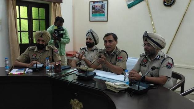 Additional director general of police (law and order), Rohit Choudhary (second from right) during a press conference in Sangrur on Saturday.(HT Photo)