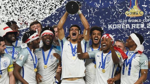England players celebrate with the trophy during the awards ceremony after winning the FIFA U-20 World Cup final. (AFP) England players celebrate with the trophy during the awards ceremony after winning the FIFA U-20 World Cup final. (AFP)