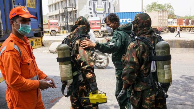 Members of the National Disaster Response Force (NDRF) prepare to take part in the clean-up operation at a container depot, where a gas leak occurred, in New Delhi. (AFP File Photo) Members of the National Disaster Response Force (NDRF) prepare to take part in the clean-up operation at a container depot, where a gas leak occurred, in New Delhi. (AFP File Photo)