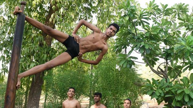 A traditional Indian sport, Mallakamb involves a gymnast performing feats with a vertical wooden pole or rope. (Toshifumi KITAMURA / AFP) A traditional Indian sport, Mallakamb involves a gymnast performing feats with a vertical wooden pole or rope. (Toshifumi KITAMURA / AFP)