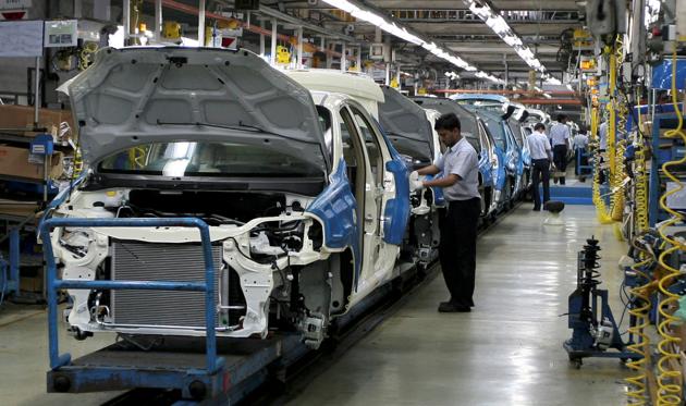 Employees work inside a plant of General Motors India Ltd. at Halol, about 150 km east from the western Indian city of Ahmedabad. (Reuters file photo)