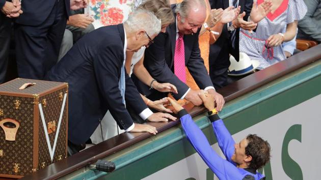 Spain's Rafael Nadal (bottom) shakds hands with Juan Carlos (top C), former King of Spain, after winning the men's final. (AFP) Spain's Rafael Nadal (bottom) shakds hands with Juan Carlos (top C), former King of Spain, after winning the men's final. (AFP)