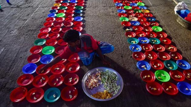 Bangladeshi volunteers prepare plates of Iftar foods for residents to break their fast at a shrine in Dhaka. Muslims throughout the world are marking the month of Ramadan, the holiest month in the Islamic calendar during which Muslims fast from dawn until dusk.