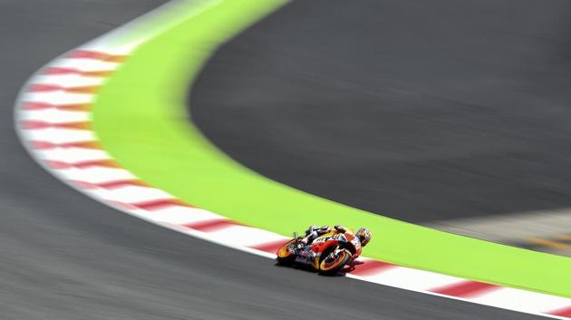 Repsol Honda Team's Spanish rider Dani Pedrosa competes during the MotoGP qualifying session of the Moto Grand Prix de Catalunya at the Circuit de Catalunya in Montmelo on the outskirts of Barcelona. (Josep LAGO / AFP)