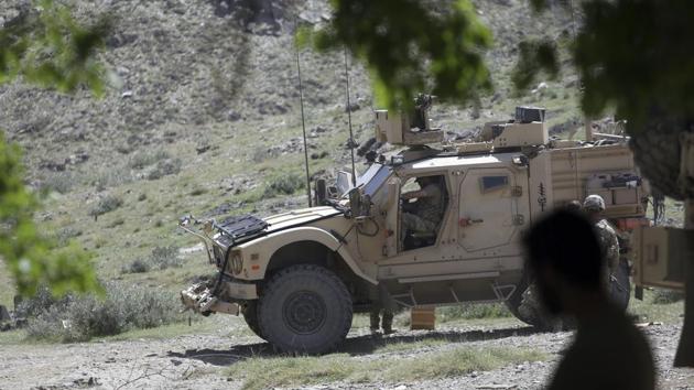 US forces and Afghan commandos patrol in Asad Khil village in the Achin district of Jalalabad. (AP File Photo) US forces and Afghan commandos patrol in Asad Khil village in the Achin district of Jalalabad. (AP File Photo)