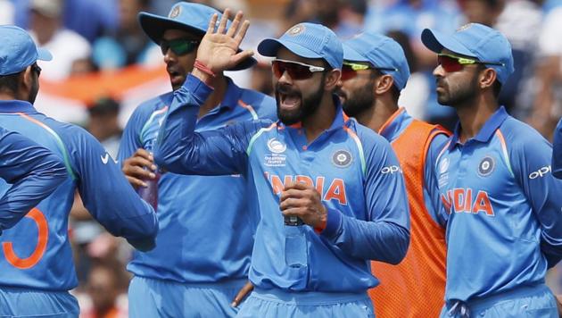 Virat Kohli (C) celebrates with teammates a South Africa dismissal in their ICC Champions Trophy match on Sunday. (AP) Virat Kohli (C) celebrates with teammates a South Africa dismissal in their ICC Champions Trophy match on Sunday. (AP)