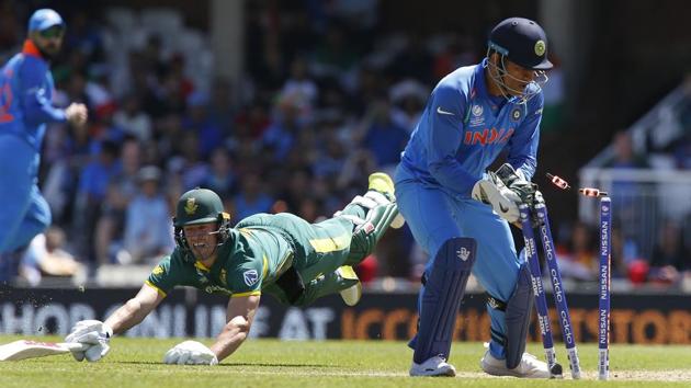 South Africa cricket team's AB de Villiers (left) is run out by India cricket team wicketkeeper MS Dhoni during their ICC Champions Trophy 2017 match at The Oval in London on Sunday. (AFP) South Africa cricket team's AB de Villiers (left) is run out by India cricket team wicketkeeper MS Dhoni during their ICC Champions Trophy 2017 match at The Oval in London on Sunday. (AFP)