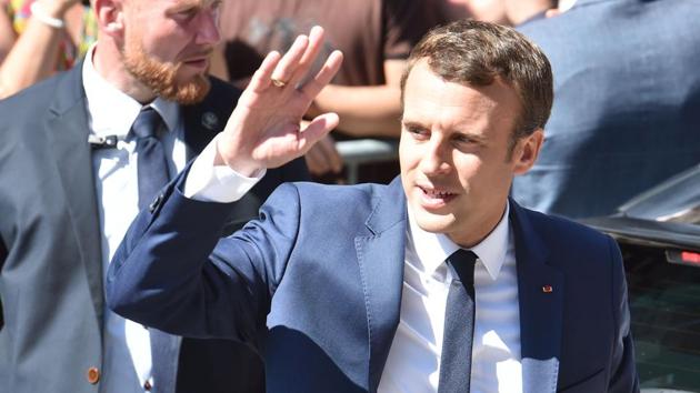 French President Emmanuel Macron (centre) waves as he leaves his home in Le Touquet, northern France during the first round of France's legislative elections. (AFP Photo) French President Emmanuel Macron (centre) waves as he leaves his home in Le Touquet, northern France during the first round of France's legislative elections. (AFP Photo)