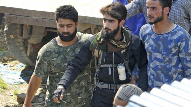 Hizbul Mujahideen militant Danish Ahmed, seen during the funeral procession of Hizbul commander Sabzar Bhat, at Rathsuna village in Tral in May. He surrendered at a police station in Handwara in Jammu and Kashmir, police said on Wednesday, 7th June. During questioning, Danish revealed that he had been in touch with militants in south Kashmir on social media and was persuaded to join them. (Waseem Andrabi/ht photo) Hizbul Mujahideen militant Danish Ahmed, seen during the funeral procession of Hizbul commander Sabzar Bhat, at Rathsuna village in Tral in May. He surrendered at a police station in Handwara in Jammu and Kashmir, police said on Wednesday, 7th June. During questioning, Danish revealed that he had been in touch with militants in south Kashmir on social media and was persuaded to join them. (Waseem Andrabi/ht photo)