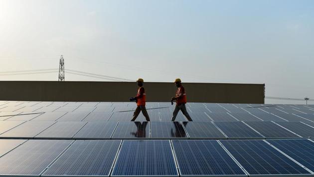 Solar power prices in India have hit rock bottom in the backdrop of fierce pricing competition between Indian and Chinese companies besides others, but it is not all good news for the electricity-starved country as the phenomenon threatens to derail the country’s effort to push its green credentials. India is the third largest emitter of greenhouse gases in the world with cities dominating the list of the most polluted on the planet. Not only can renewable energy transform thousands of villages and towns across this vast country, it can put also India on a growth accelerator into the future. (Chandan Khanna/APF)