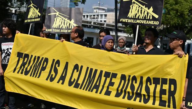 Greenpeace activists display a banner during a rally following US President Donald Trump's decision to quit the Paris climate accord. (AFP File Photo) Greenpeace activists display a banner during a rally following US President Donald Trump's decision to quit the Paris climate accord. (AFP File Photo)