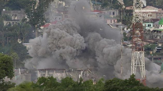 Debris and smoke rises after a Philippine Air Force fighter jets bombed suspected locations of Muslim militants, in Marawi city, southern Philippines on June 9. (AP Photo) Debris and smoke rises after a Philippine Air Force fighter jets bombed suspected locations of Muslim militants, in Marawi city, southern Philippines on June 9. (AP Photo)
