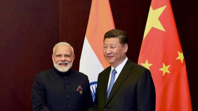 Prime Minister Narendra Modi and Chinese President Xi Jinping on the sidelines of the SCO Summit in Astana, Kazakhstan, June 9(PTI)