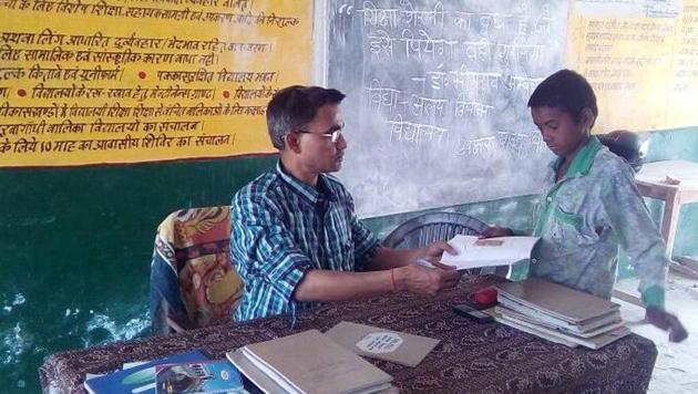 A teacher interacts with a student in a classroom at a government primary school in Bihar. (HT file photo) A teacher interacts with a student in a classroom at a government primary school in Bihar. (HT file photo)