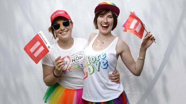 Katrina, 25 (L), and Devon, 22, pose for a portrait during the Resist March against President Donald Trump. Katrina says, ‘There are so many issues that young people really, really care about because it's our future and our children's future. We're afraid.’ (REUTERS) Katrina, 25 (L), and Devon, 22, pose for a portrait during the Resist March against President Donald Trump. Katrina says, ‘There are so many issues that young people really, really care about because it's our future and our children's future. We're afraid.’ (REUTERS)