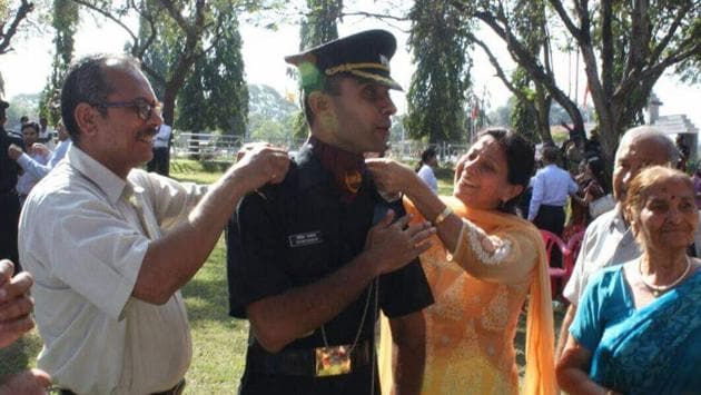 Lt Nitish Kakkar with his parents in 2015. (HT Photo) Lt Nitish Kakkar with his parents in 2015. (HT Photo)