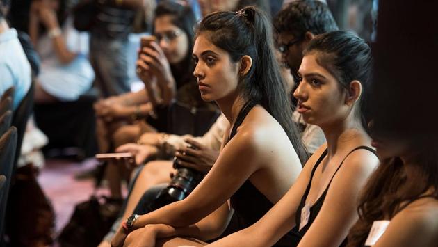 Models watch as other participants walk the ramp.  (Aalok Soni/HT Photo) 