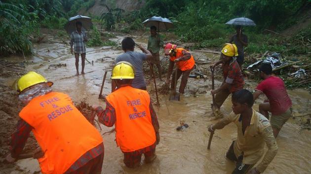 Bangladeshi fire fighters and residents search for bodies after a landslide in Bandarban on Tuesday. (AFP) Bangladeshi fire fighters and residents search for bodies after a landslide in Bandarban on Tuesday. (AFP)