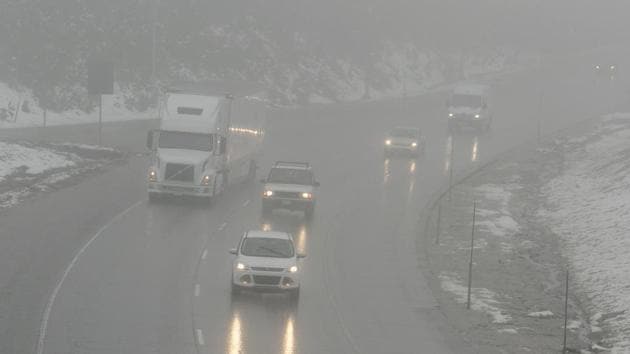 Vehicles drive through fog and and a light rain on eastbound Highway 8, near Soda Springs, Calif. In late winter and early spring, the snowpack was as large as it had been in decades. (Rich Pedroncelli / AP) Vehicles drive through fog and and a light rain on eastbound Highway 8, near Soda Springs, Calif. In late winter and early spring, the snowpack was as large as it had been in decades. (Rich Pedroncelli / AP)