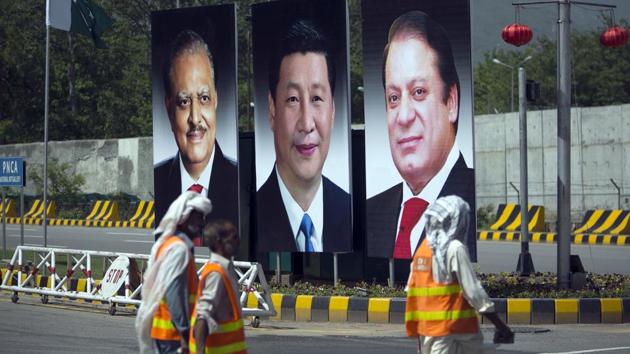 A billboard of Pakistan's president Mamnoon Hussain (left) and Prime Minister Nawaz Sharif with Chinese president Xi Jinping (centre) on display during a two-day visit by the Chinese president to launch an ambitious $45 billion economic corridor linking Pakistan's Gwadar with western China, in Islamabad, Pakistan. (AP File Photo) A billboard of Pakistan's president Mamnoon Hussain (left) and Prime Minister Nawaz Sharif with Chinese president Xi Jinping (centre) on display during a two-day visit by the Chinese president to launch an ambitious $45 billion economic corridor linking Pakistan's Gwadar with western China, in Islamabad, Pakistan. (AP File Photo)