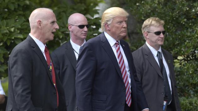President Donald Trump, his longtime bodyguard Keith Schiller, left, and two Secret Service agents walk along the South Lawn of the White House in Washington on June 12. (AP Photo) President Donald Trump, his longtime bodyguard Keith Schiller, left, and two Secret Service agents walk along the South Lawn of the White House in Washington on June 12. (AP Photo)