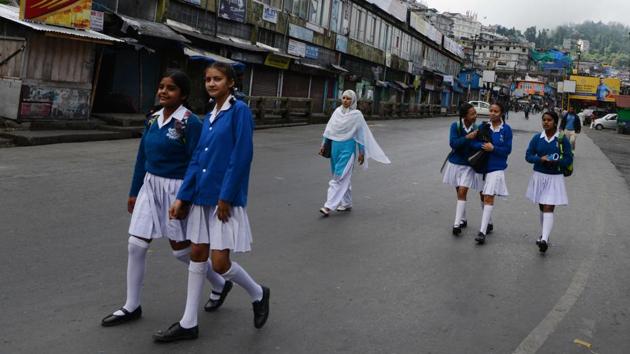 Students return home after schools closed down due to the general strike. (AFP) Students return home after schools closed down due to the general strike. (AFP)