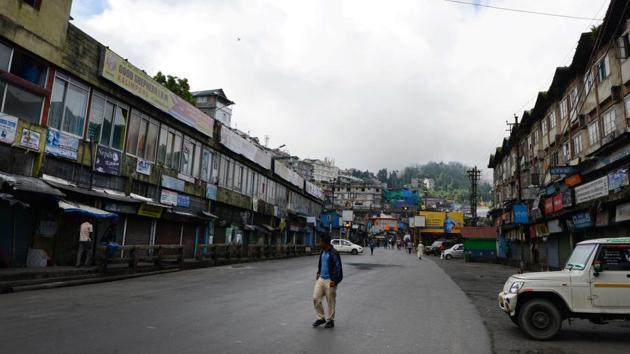A man walks past closed shops during a general strike called by the Gorkha Janmukti Morcha (GJM) in Darjeeling. Thousands of tourists fled the hill resort after local activists demanding the creation of a new state warned that a general strike could degenerate into violence.The GJM seemed to gain momentum from a joint forum of 26 trade unions calling for a two-day general strike among tea workers. Currently paramilitary forces are patrolling the city with all government and Gorkhaland Territorial Administration (GTA) offices closed indefinitely. (AFP) A man walks past closed shops during a general strike called by the Gorkha Janmukti Morcha (GJM) in Darjeeling. Thousands of tourists fled the hill resort after local activists demanding the creation of a new state warned that a general strike could degenerate into violence.The GJM seemed to gain momentum from a joint forum of 26 trade unions calling for a two-day general strike among tea workers. Currently paramilitary forces are patrolling the city with all government and Gorkhaland Territorial Administration (GTA) offices closed indefinitely. (AFP)