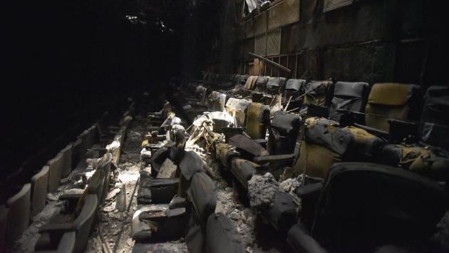 A desolate view of the cinema hall, 20 years since it was gutted in a fire. (Burhaan Kinu/HT PHOTO)