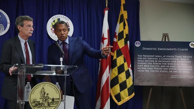 Maryland Attorney General Brian (L) and District of Columbia Attorney General Karl Racine speak to the media about filing a lawsuit against U.S. President Donald Trump, on June 12, 2017 in Washington, DC. The suit alleges that Trump has violated the Constitution by taking payments from foreign governments while being President of the United States. (AFP Photo) Maryland Attorney General Brian (L) and District of Columbia Attorney General Karl Racine speak to the media about filing a lawsuit against U.S. President Donald Trump, on June 12, 2017 in Washington, DC. The suit alleges that Trump has violated the Constitution by taking payments from foreign governments while being President of the United States. (AFP Photo)