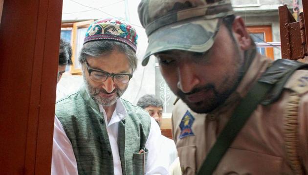 Jammu and Kashmir police detain JKLF chairman Mohammad Yasin Malik while he was going for a joint separatist meeting in Srinagar on June 12, 2017. (PTI) Jammu and Kashmir police detain JKLF chairman Mohammad Yasin Malik while he was going for a joint separatist meeting in Srinagar on June 12, 2017. (PTI)