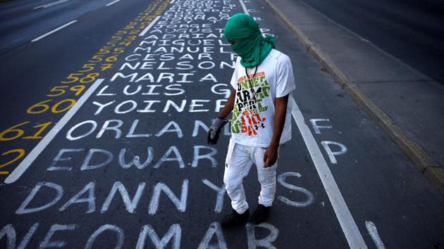 More than 60 people have been killed and hundreds more arrested during months of violent clashes.Some deaths have been linked to both opposition and pro-government protests while others happened during acts of vandalism unrelated to the political unrest. (Ivan Alvarado / REUTERS)