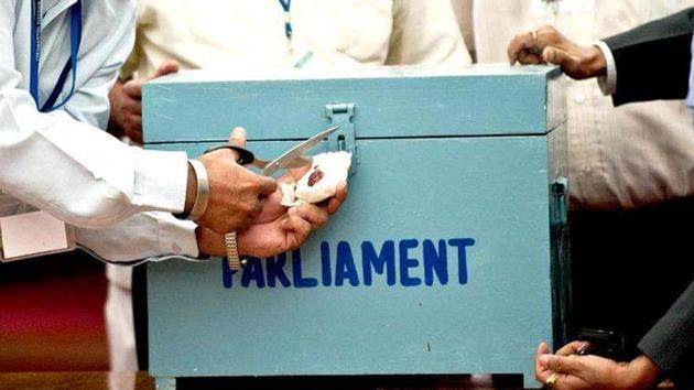 Election observers and officials open the seal of a ballot box as they begin tallying the presidential election results, at the Parliament in New Delhi. (AFP File Photo) Election observers and officials open the seal of a ballot box as they begin tallying the presidential election results, at the Parliament in New Delhi. (AFP File Photo)