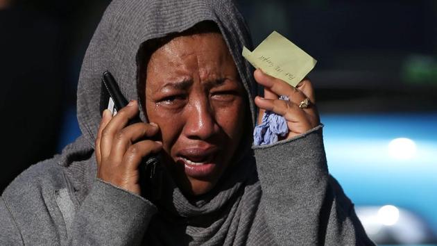 A woman cries as she tries to locate a missing relative suspected of being affected by the massive fire that engulfed Grenfell Tower, a residential block . (Daniel LEAL-OLIVAS / AFP)