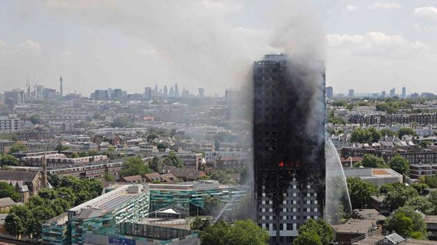 Smoke and flames billows from Grenfell Tower as firefighters attempt to control a blaze at a residential block of flats.(AFP Photo) Smoke and flames billows from Grenfell Tower as firefighters attempt to control a blaze at a residential block of flats.(AFP Photo)