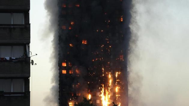 Smoke and flames rise from building on fire in London on June 14. (AP Photo) Smoke and flames rise from building on fire in London on June 14. (AP Photo)
