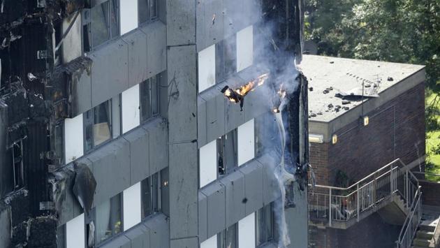 Between 400 and 600 people were estimated to be lived in the building. (Matt Dunham / AP)